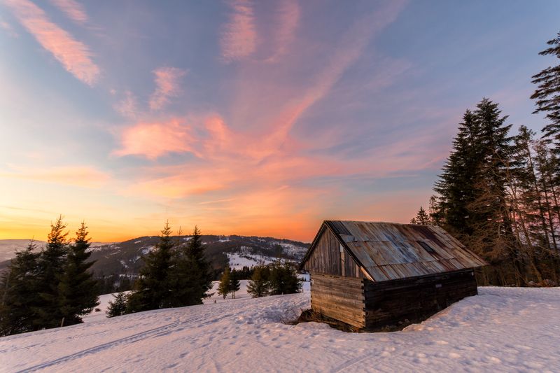 Sunset over abandoned cabin