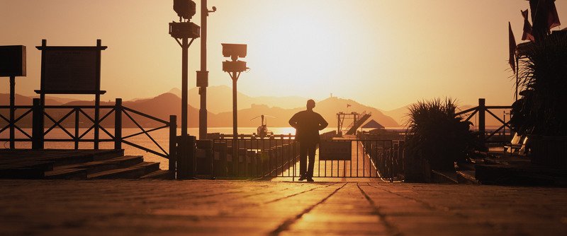 Man at the pier in the morning