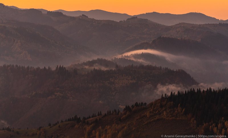 Misty Mountains Fog over forests and hills in Carpathian Mountains