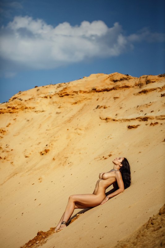 На песке...
